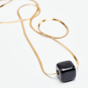 stability necklace in black and gold